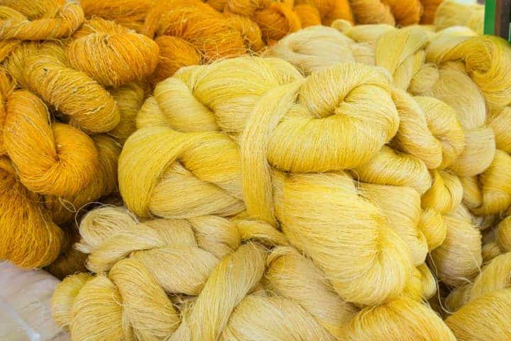 Silk Yarn skeins of various shades of yellow. Silk Yarn is perfect for summer knits