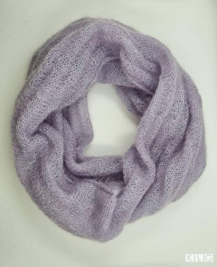 Reverse Stockinette stitch in a knitted cowl. Pale Lilac mohair yarn