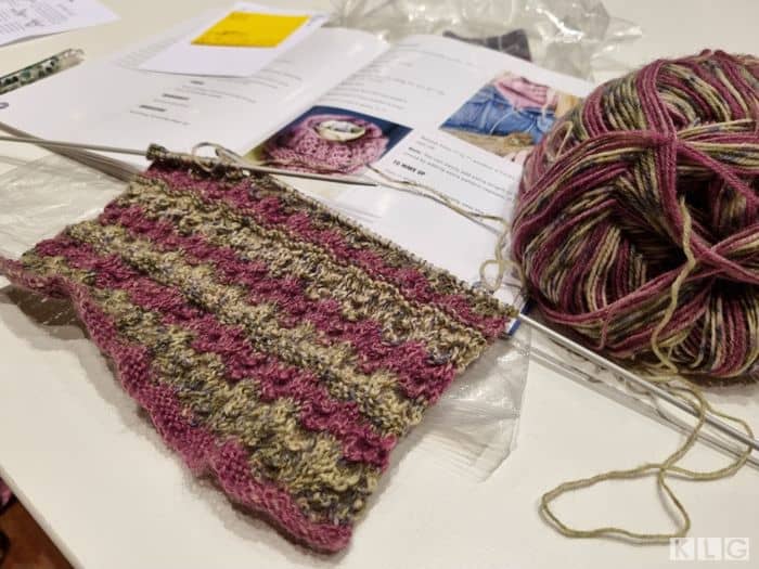 Betty's knitted snood in purple and grey brown yarns