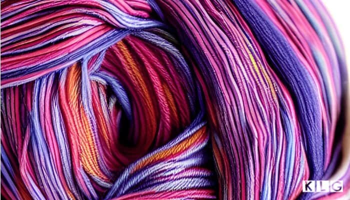 Self Striping yarn in closeup - colors of pink, orange, purples